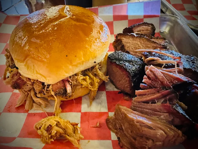 Pulled pork sandwich with sliced brisket