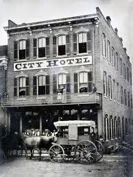 The City Hotel in Waterloo, Illinois, with a horse-drawn wagon parked out front