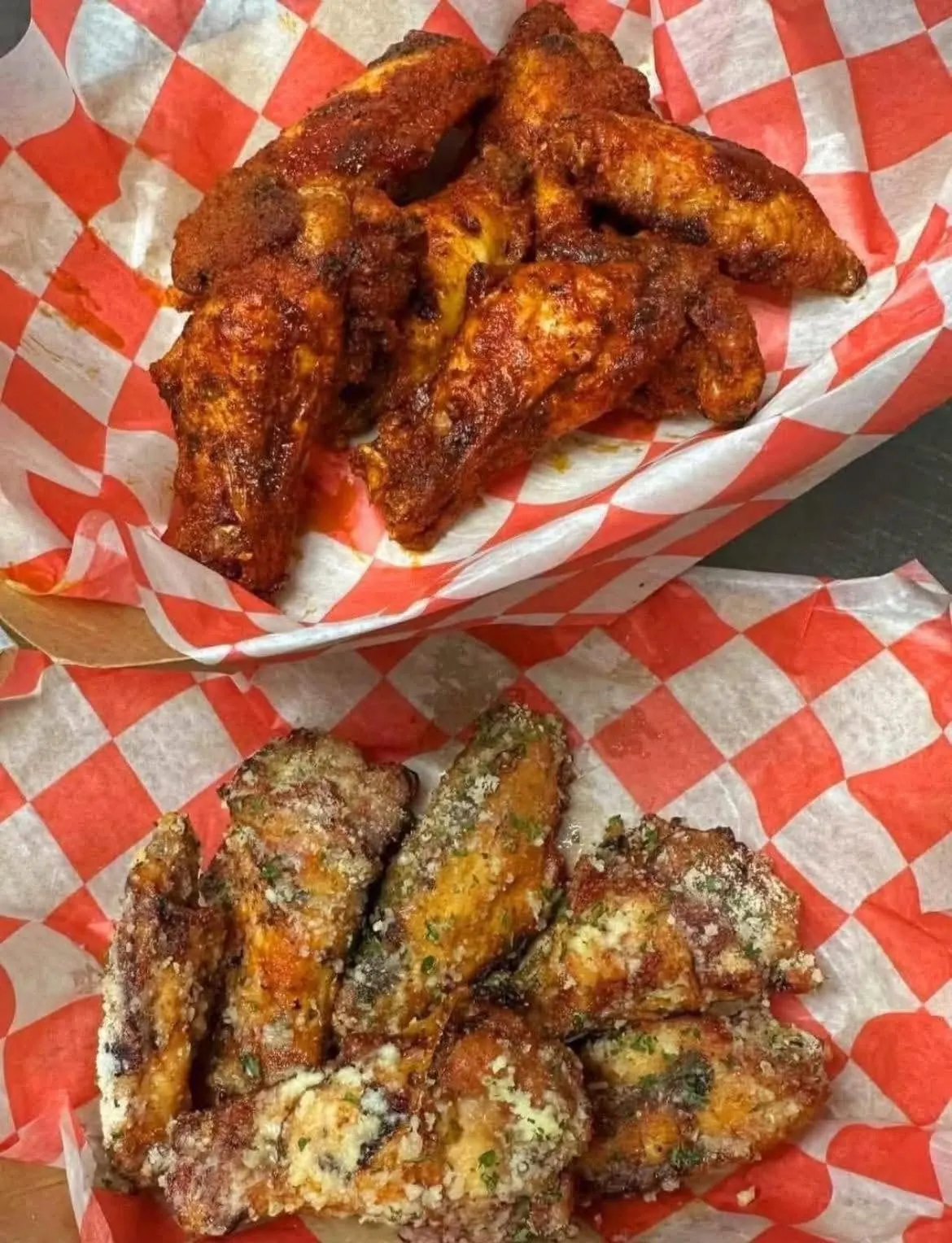 Baskets of buffalo wings and garlic parmesan wings